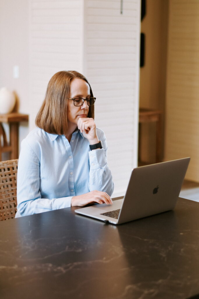 woman at computer drawing planograms / modulars