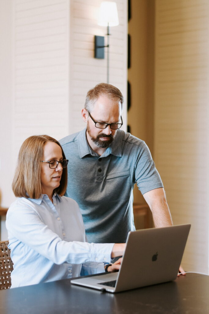 couple at computer discussing category or planogram / modular