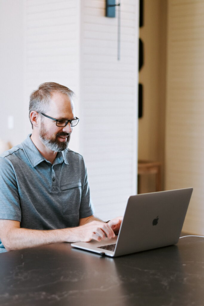 man at computer doing analytics